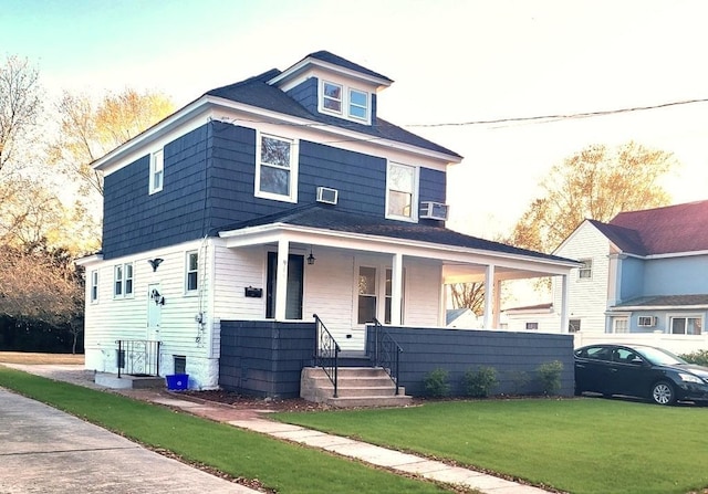 view of front of property featuring a porch and a front lawn