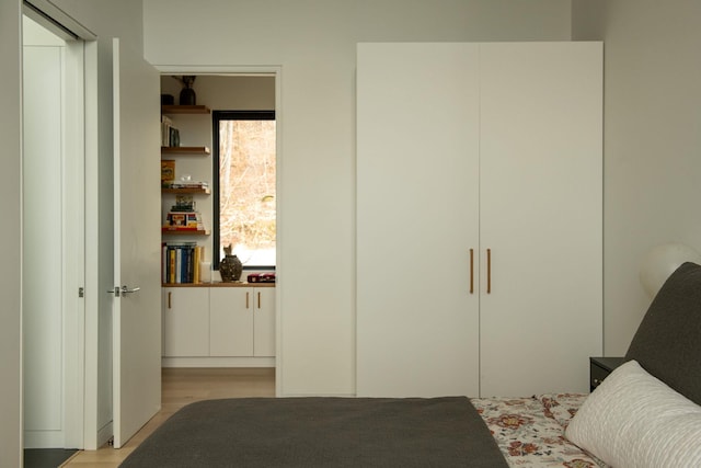 bedroom with light hardwood / wood-style floors