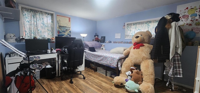 bedroom with hardwood / wood-style floors