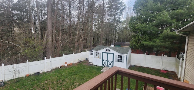 view of yard with a shed and a deck