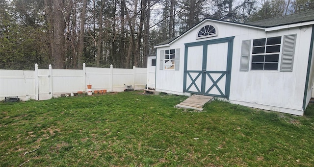 view of outbuilding featuring a lawn