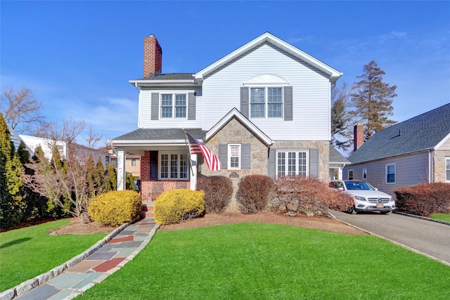 view of front property with a front lawn