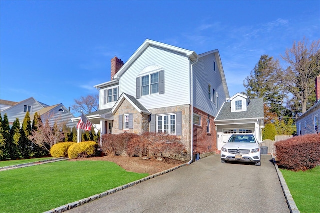 view of front property with a garage and a front lawn