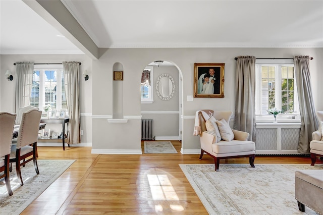 living area with radiator and light hardwood / wood-style flooring