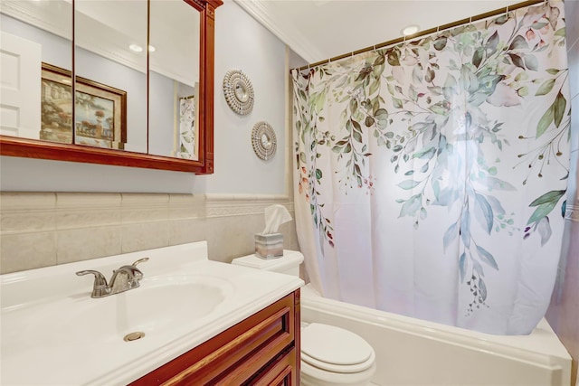 full bathroom with crown molding, vanity, shower / bath combination with curtain, and toilet