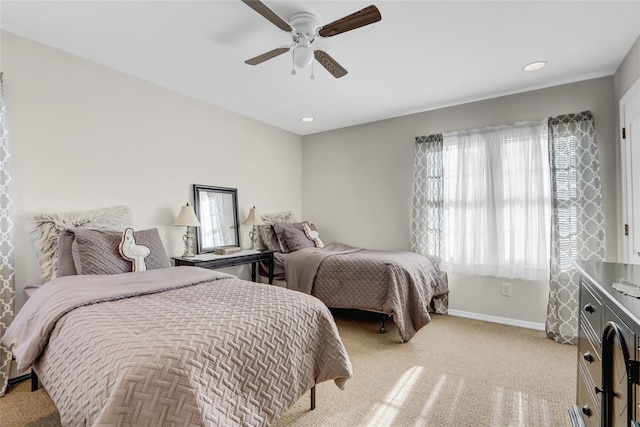 carpeted bedroom with ceiling fan