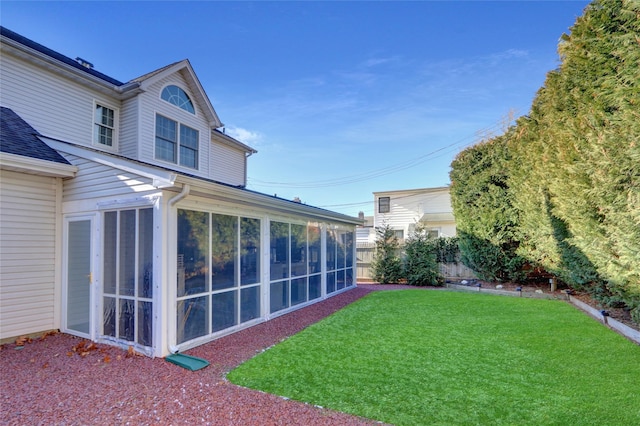 view of yard featuring a sunroom