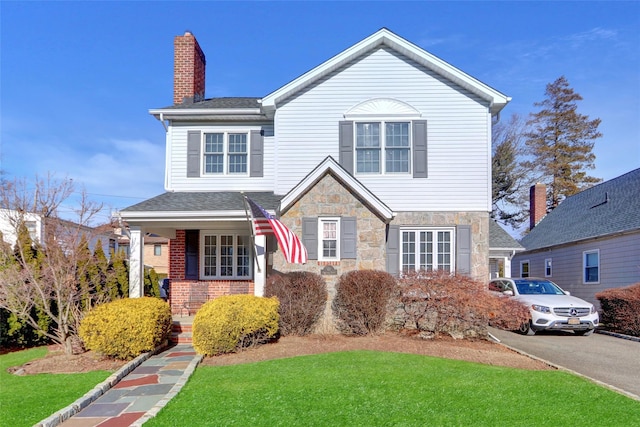 view of front property with a front lawn