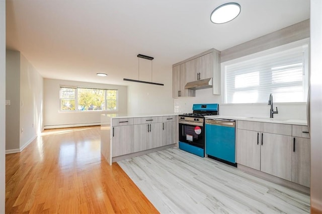 kitchen with light wood-type flooring, stainless steel dishwasher, gas range oven, sink, and decorative light fixtures