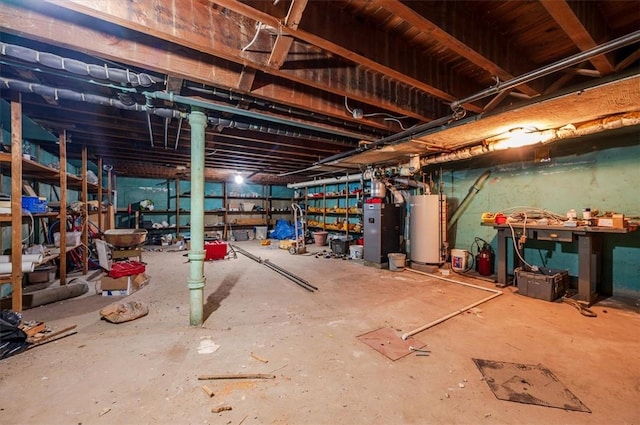 misc room featuring concrete flooring and water heater