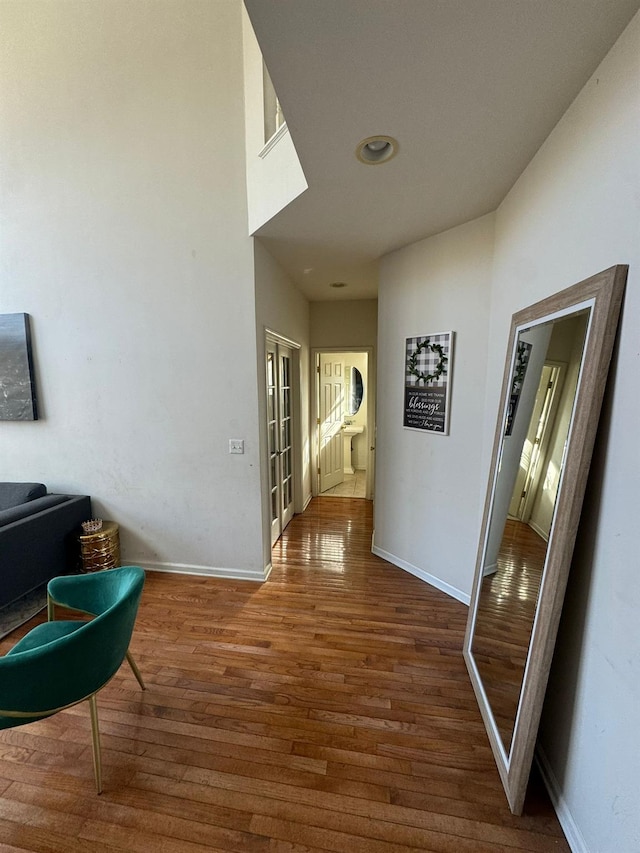 corridor with wood-type flooring