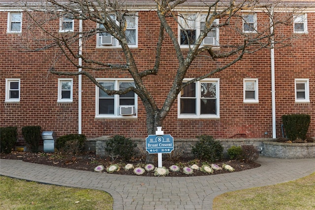 view of side of home featuring cooling unit