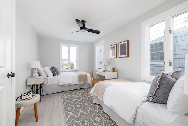 bedroom with ceiling fan and hardwood / wood-style floors