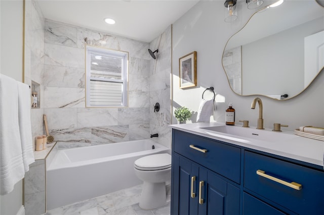 full bathroom featuring vanity, toilet, and tiled shower / bath