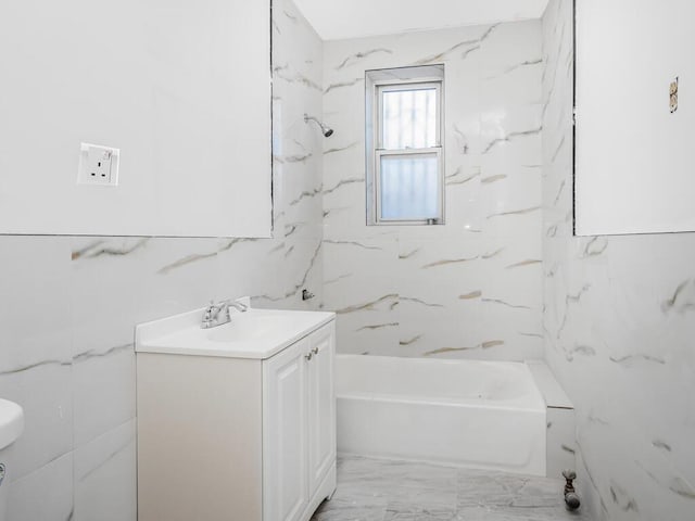 bathroom with vanity and a bathing tub