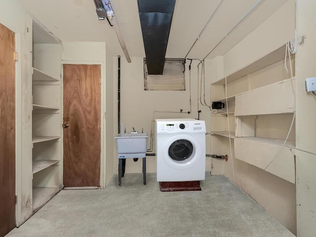 laundry area with washer / dryer and sink