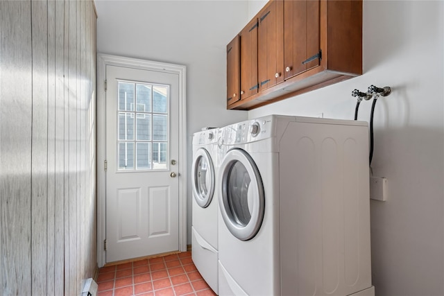 laundry room with light tile patterned floors, cabinets, washer and dryer, and baseboard heating