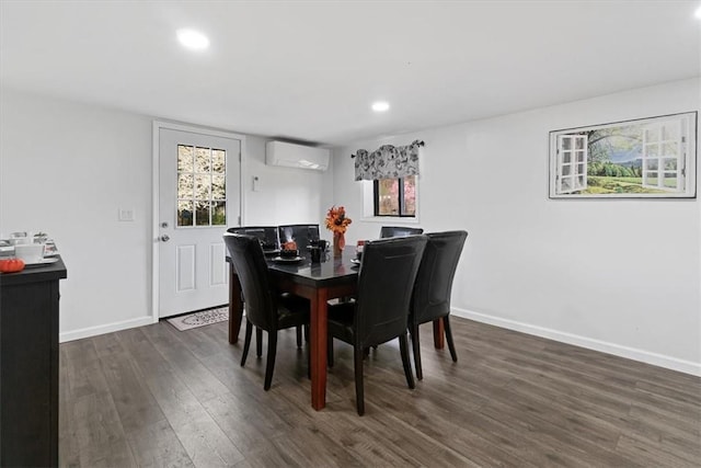 dining space with a wall mounted AC and dark wood-type flooring