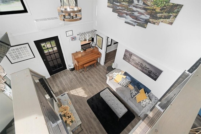 entryway with hardwood / wood-style floors and a high ceiling