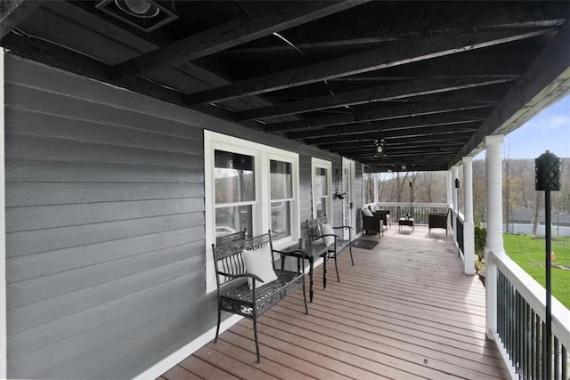 wooden terrace featuring covered porch