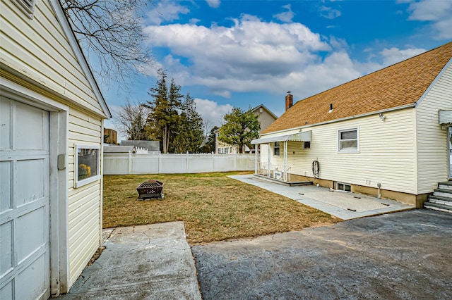 view of yard featuring a fire pit and a patio area