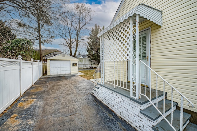 exterior space with an outdoor structure and a garage