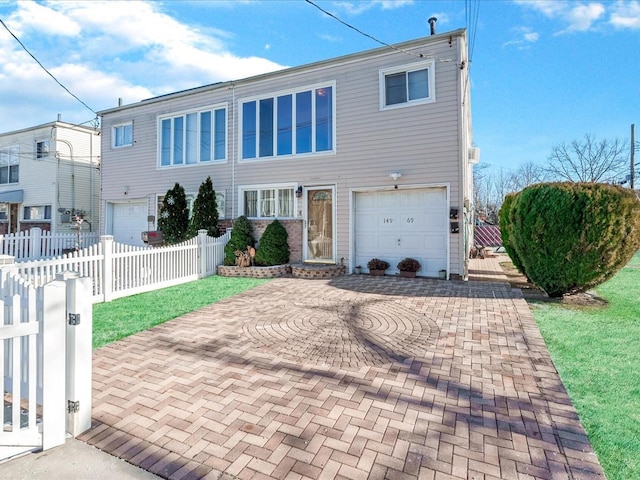 view of front of home with a garage