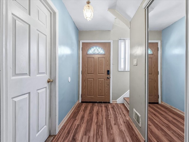 doorway to outside featuring dark hardwood / wood-style floors