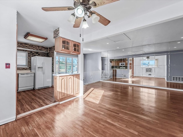 unfurnished living room with wood-type flooring