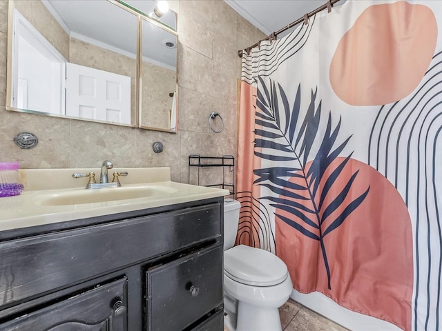 full bathroom with vanity, toilet, tile walls, and ornamental molding