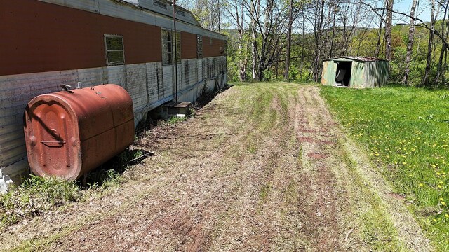 23 Peters Rd, Fremont, NY 12723 - view of yard featuring oil tank, a storage shed, and an outdoor structure