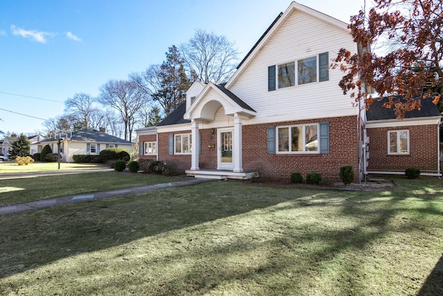 view of property featuring a front lawn