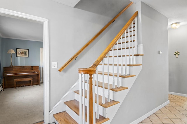 stairs with tile patterned flooring and ornamental molding