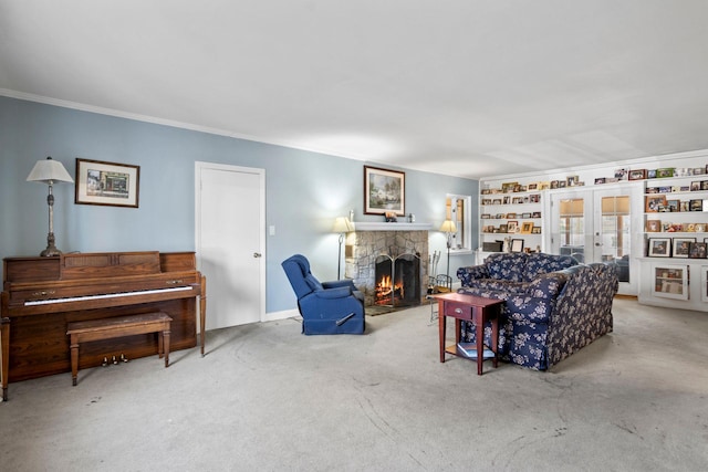 living room featuring a fireplace, french doors, crown molding, and carpet flooring