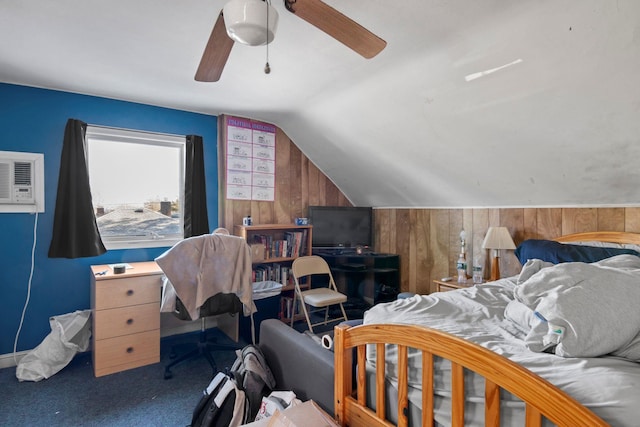 carpeted bedroom with lofted ceiling, a wall unit AC, ceiling fan, and wooden walls