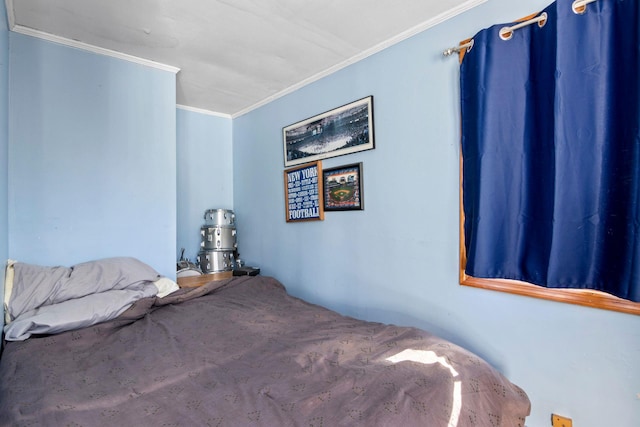 bedroom with ornamental molding