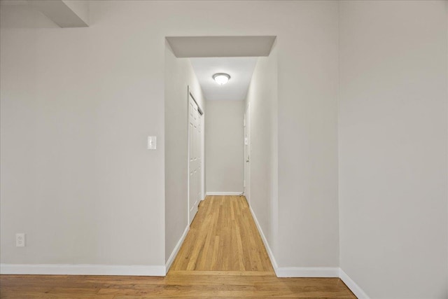 hallway featuring hardwood / wood-style floors