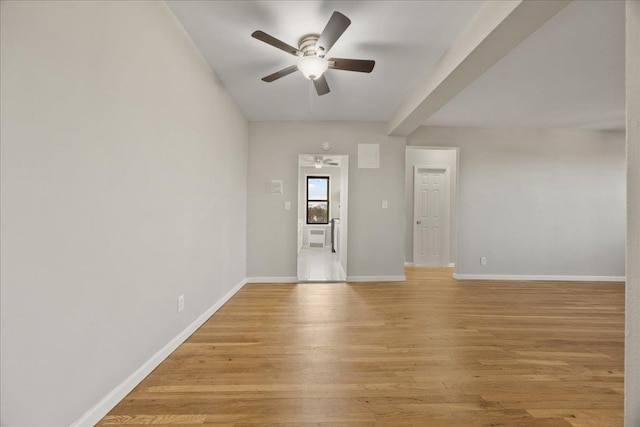 empty room featuring ceiling fan and light wood-type flooring