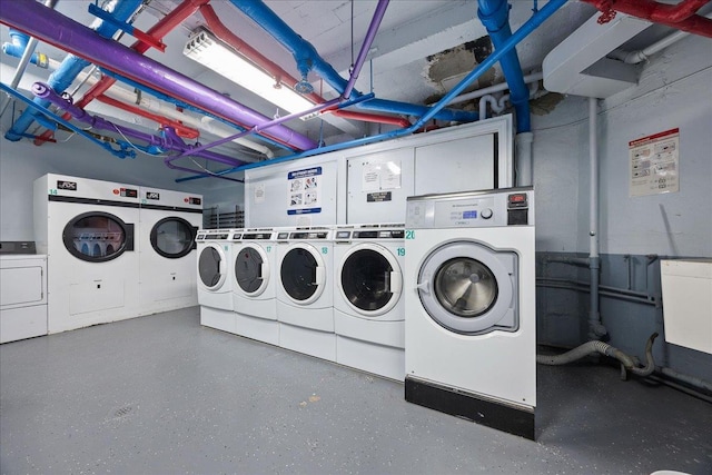 washroom featuring washing machine and clothes dryer