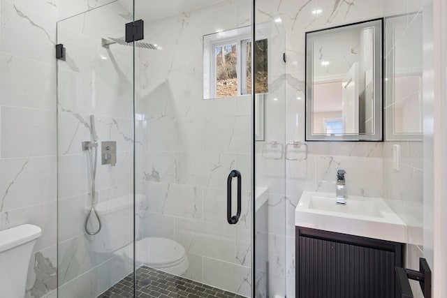 bathroom with toilet, vanity, radiator, and walk in shower