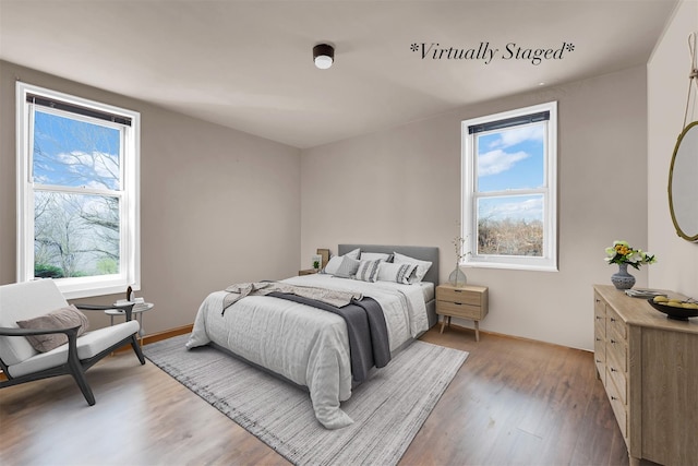 bedroom with hardwood / wood-style floors