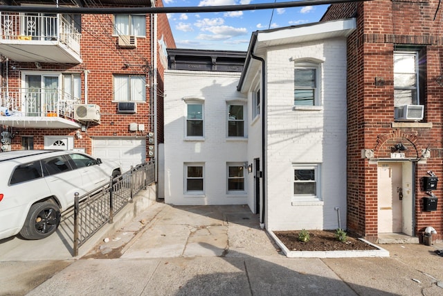 view of front of house with cooling unit and ac unit