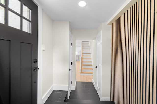 interior space with dark tile patterned flooring