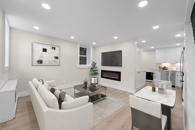 living room with light hardwood / wood-style flooring