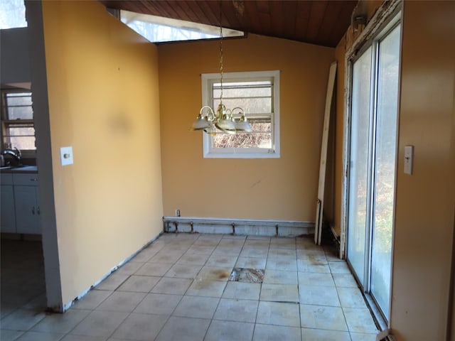 interior space featuring wooden ceiling, an inviting chandelier, sink, vaulted ceiling, and light tile patterned flooring