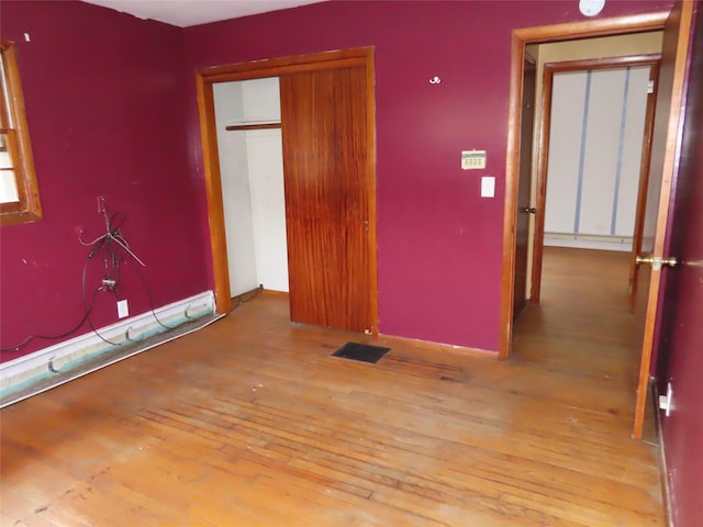 unfurnished bedroom featuring light hardwood / wood-style flooring