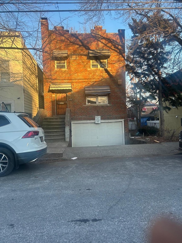 view of front of property featuring a garage