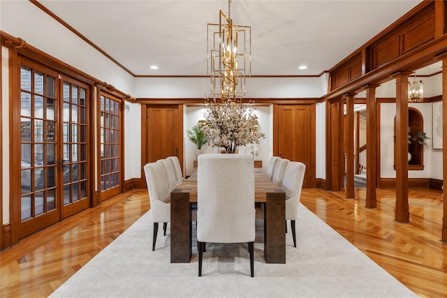 dining room featuring light parquet floors and crown molding