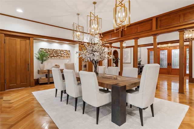 dining space with light parquet floors and french doors