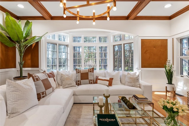 sunroom / solarium featuring beam ceiling, a notable chandelier, and coffered ceiling